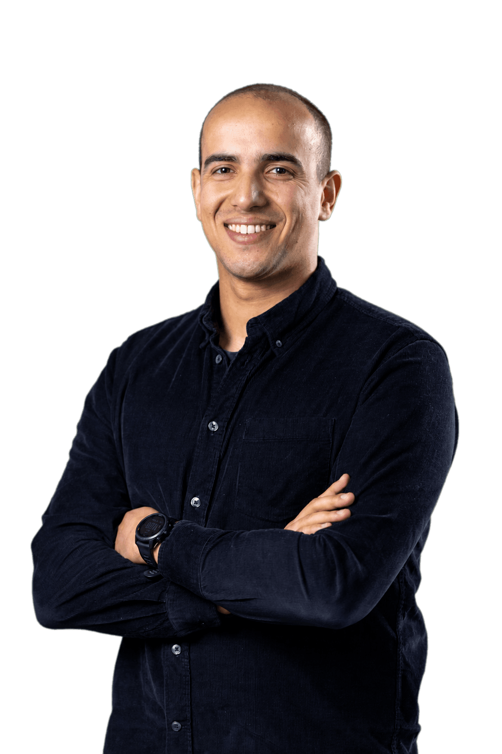 Youssef Agouzoul smiling with his arms crossed.